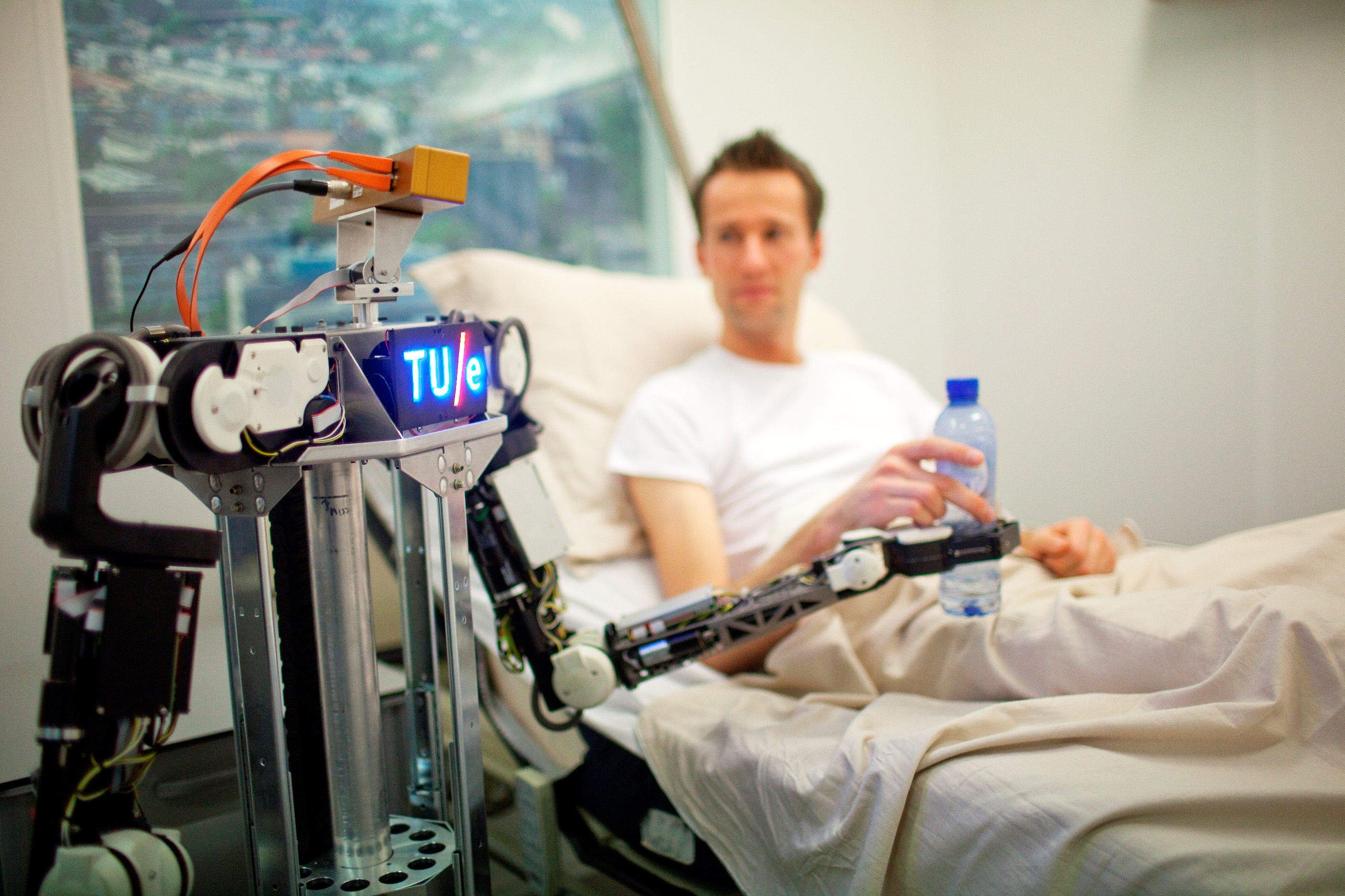 patient being taken care of by a robot